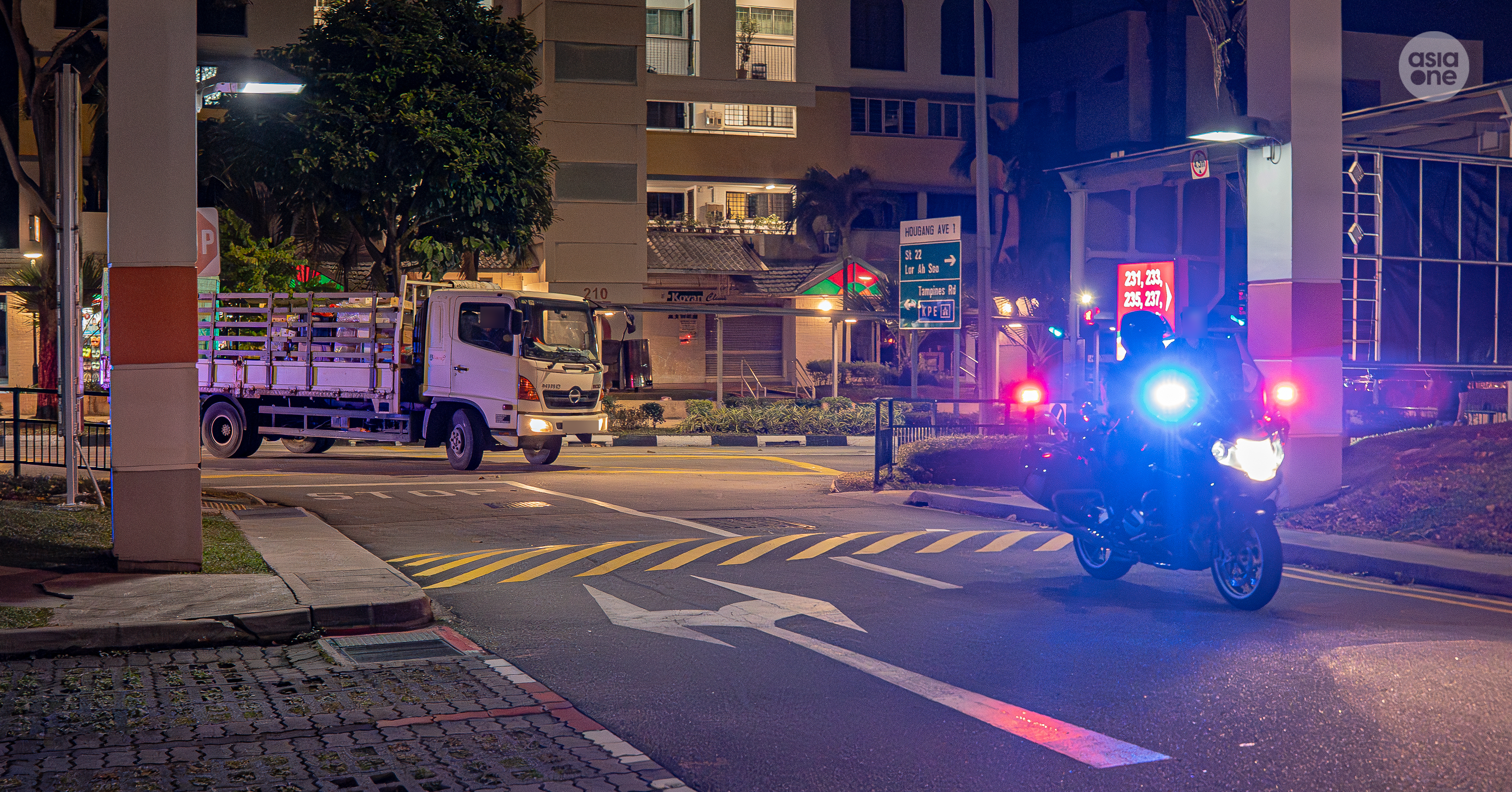 Traffic Police's Special Operations Team officers escorting a lorry for compliance checks.